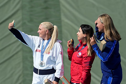Women's Skeet:  Silver medalist Britain's Amber Jo Rutter, left, gold medalist Chile's Francisca Crovetto Chadid, center, and bronze medalist Austen Jewell Smith of the United States